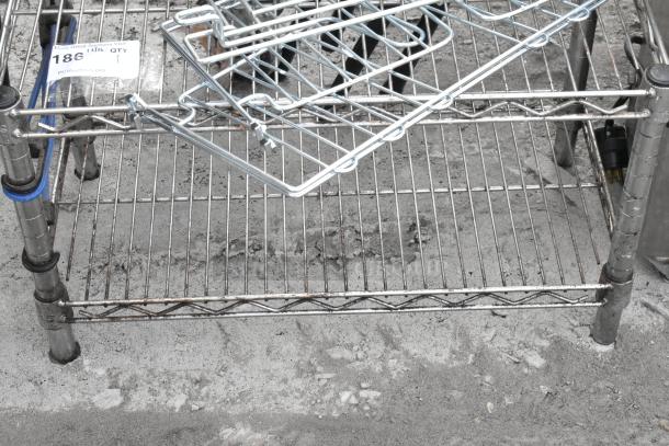 Chrome finish 2-tier wire shelving unit with contents, includes multiple wire hangers. Note: Buyer must dismantle.