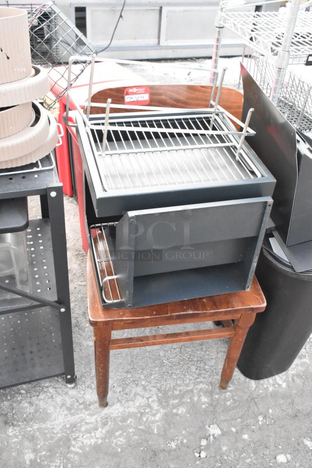 Lot of various items including a wooden chair, black metal shelving unit, and assorted racks, showing visible wear.