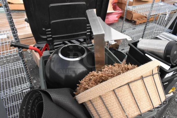 Two poly trash cans filled with assorted contents including baskets and floor mats. Items appear in used condition.