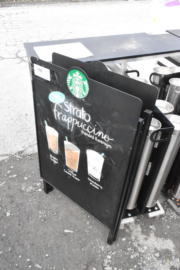 A Frame Sidewalk Sign featuring Starbucks logo, promoting Strato Frappuccino beverages; black with visible scuffs.