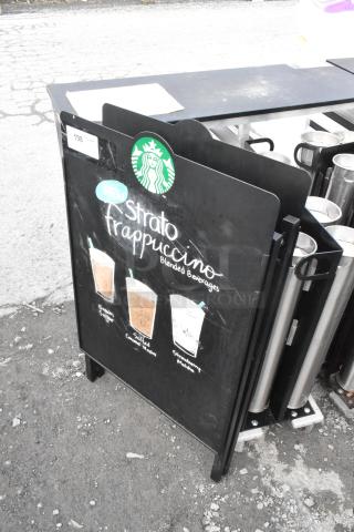 A Frame Sidewalk Sign featuring Starbucks logo, promoting Strato Frappuccino beverages; black with visible scuffs.
