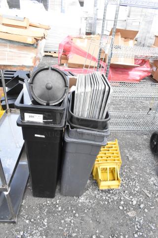 Lot of items including black and gray Poly Slim Jim trash cans, metal pans, and yellow racks. Used condition.
