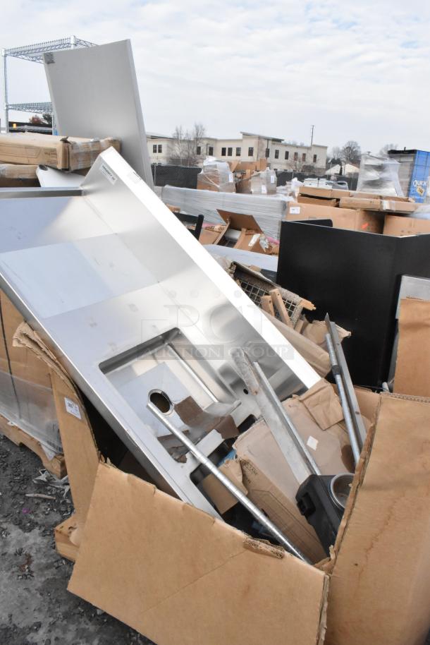 5 Brand New Scratch and Dent items, including a Regency work table and baking pans, in packaging.