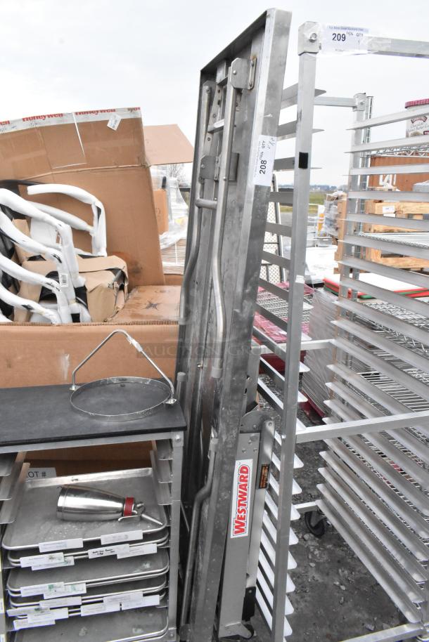 Metal folding table and Westward ladder attachment. Items are in used condition with visible labels and markings.