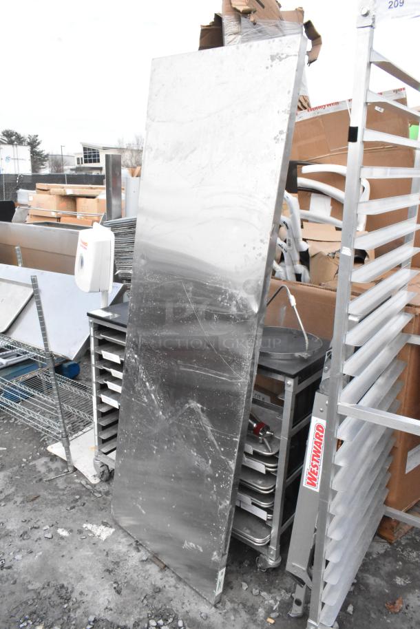 Metal folding table and Westward ladder attachment. Table shows wear; ladder attachment displays clear Westward label.