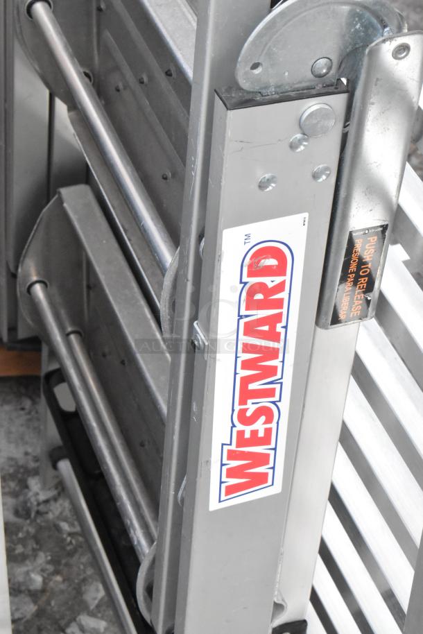 Metal folding table and Westward ladder attachment, sturdy build, visible Westward branding.
