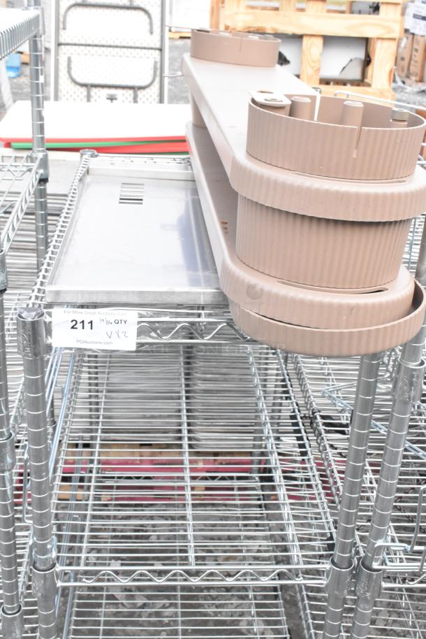 Two chrome wire shelving units, sturdy design, includes empty beige trays. Tag reads "211." Buyer must dismantle for shipping.