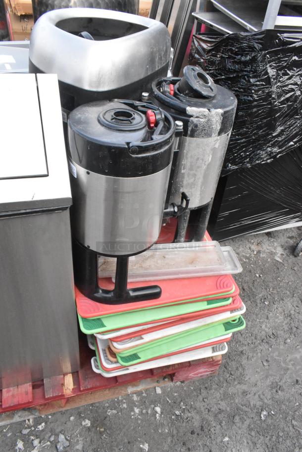 Pallet with trash can shells, cutting boards, hot beverage dispensers; mixed colors and used condition.