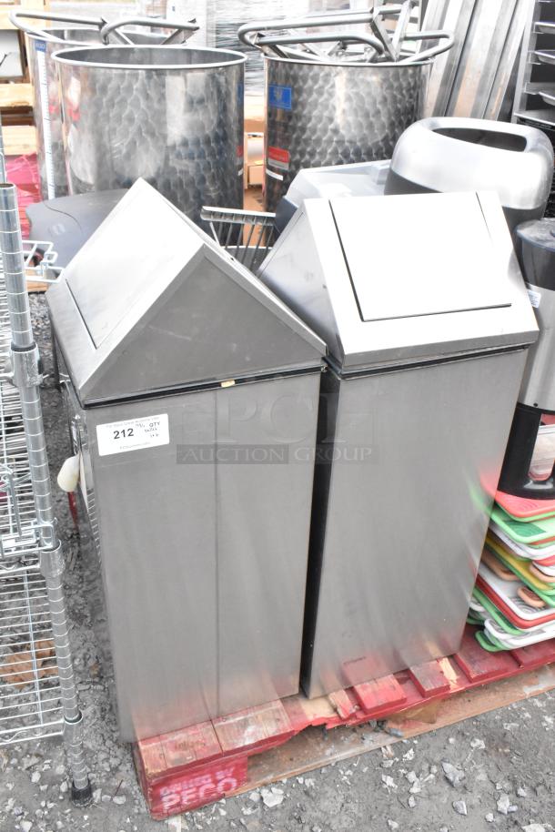 Pallet with various items including metal trash can shells, assorted cutting boards, and a hot beverage dispenser.