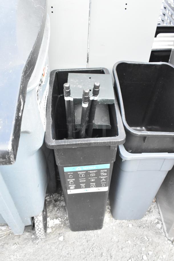 Four various trash cans including Slim Jim; black, blue, and grey cans with visible labels. Used condition.