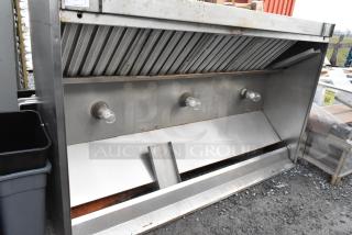 8' commercial metal grease hood with filters and lights, in used condition, showing slight wear and functional components.