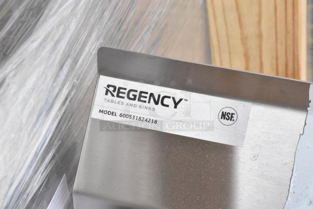 Regency 600S31824218 stainless steel 3 bay sink, scratch and dent, with dual drain boards, no legs, NSF certified.