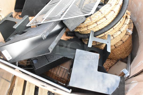 Pallet lot containing assorted items, including baskets, a lid dispenser, and various metal and rope components. Mixed condition.