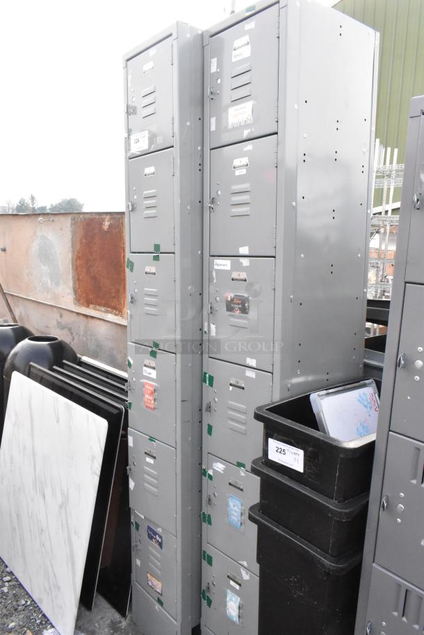 Two gray metal lockers with six cubbies each, featuring ventilation slots and name tags. Used but in good condition.