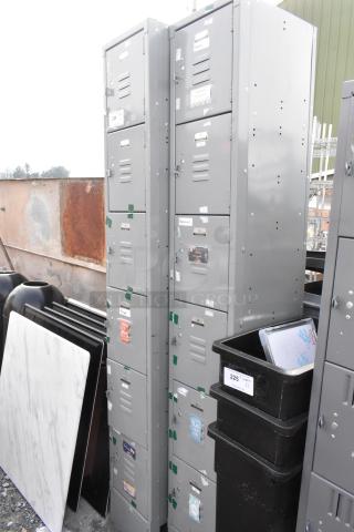 Two gray metal lockers with six cubbies each, featuring ventilation slots and name tags. Used but in good condition.
