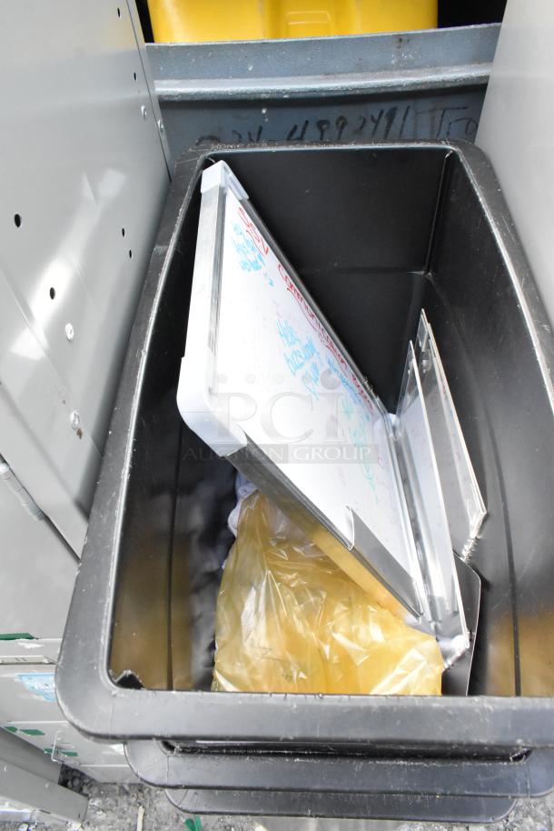 3 Black Poly Slim Jim Trash Cans in good condition, open lid with yellow bag inside. Auction for 3 times your bid.