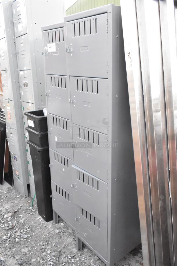 Two gray metal lockers with 5 cubbies each. Durable design, minor surface wear. Ideal for storage or organization.