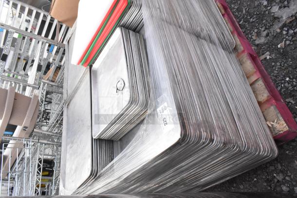 Stack of 180 items including full and half-size metal baking pans and cutting boards, wrapped and labeled on a pallet.