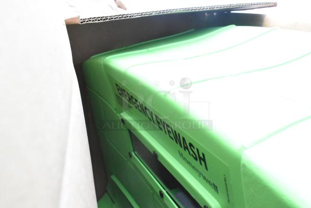 Honeywell Fendall Pure Flow 1000 Portable Emergency Eyewash Station, new, in green casing with visible label.