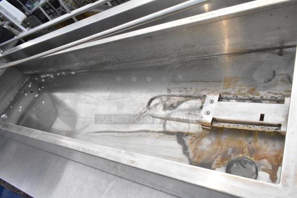 Avantco 177BMFW5 stainless steel 57" electric bain marie, shows interior and heating element, some wear visible.