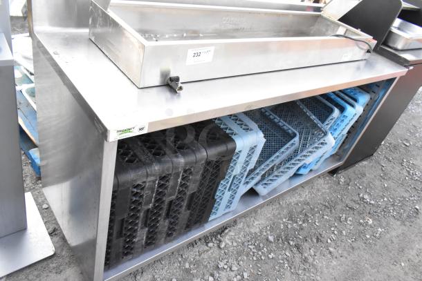 Regency 600EBTB2472 stainless steel table, 24"x72", with adjustable midshelf, 6" backsplash, used condition, NSF label.