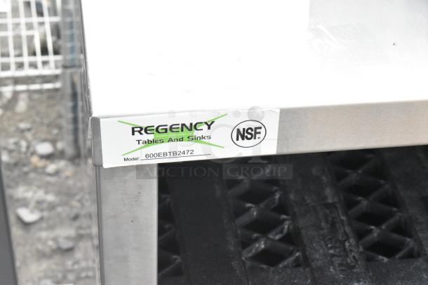 Regency 600EBTB2472 24" x 72" stainless steel table, enclosed base, open front, adjustable midshelf, 6" backsplash, NSF certified.
