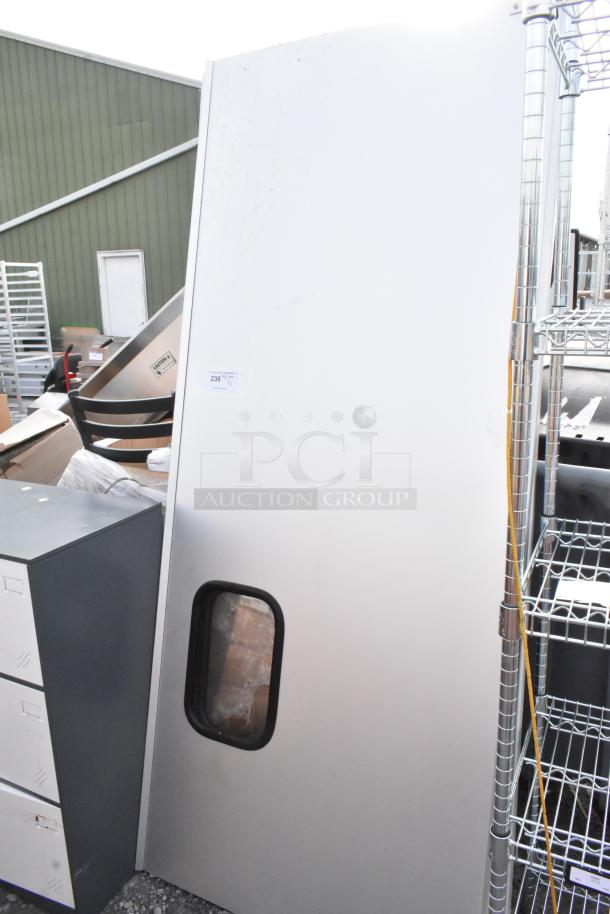 Two metal swinging kitchen doors, white finish, inspection window, bidding label shows lot number 236.