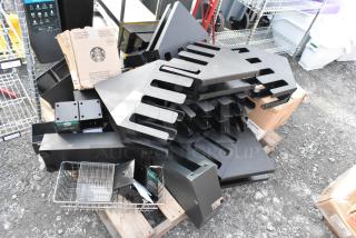Pallet lot including multiple black lid dispensers, wire baskets, and a Starbucks cardboard box, in used condition.