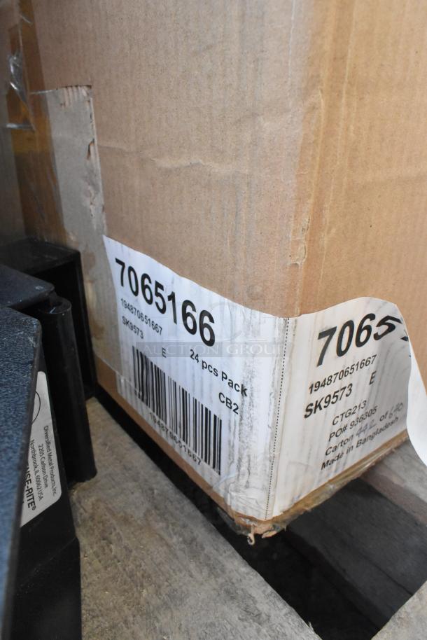 Pallet lot of various items, including lid dispensers. Box label reads "7065166, 24 pcs Pack, SK9573, Made in Bangladesh."