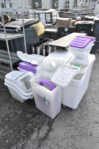 Eight new scratch and dent poly bins; includes clear and white ingredient bins with lids and wheels.