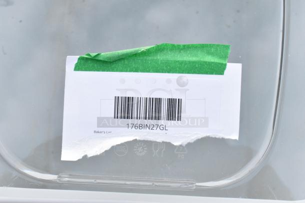 Clear poly bin with green tape label, barcode "176BIN27GL." New with minor scratches and dents. Ideal for storage needs.