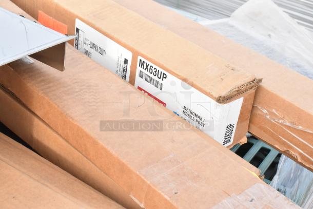 Cardboard boxes labeled "MX63UP MetroMax iQ Mobile Post," part of 16 new scratch and dent items.