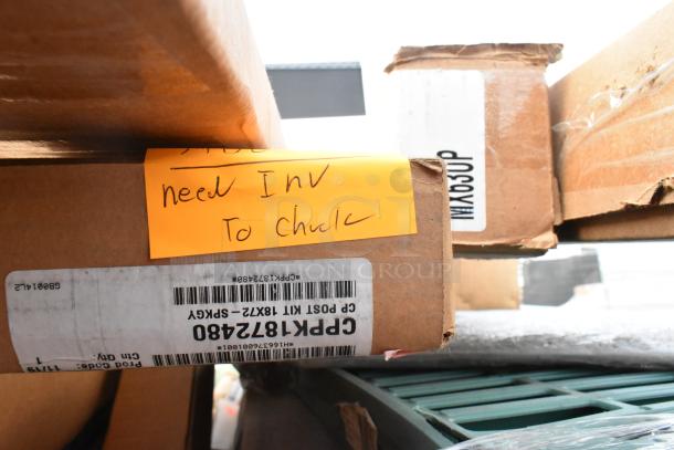 Boxes labeled MX63UP and CPSK1872V5480, part of a scratch and dent auction lot with items like MetroMax iQ and Cambro shelving.