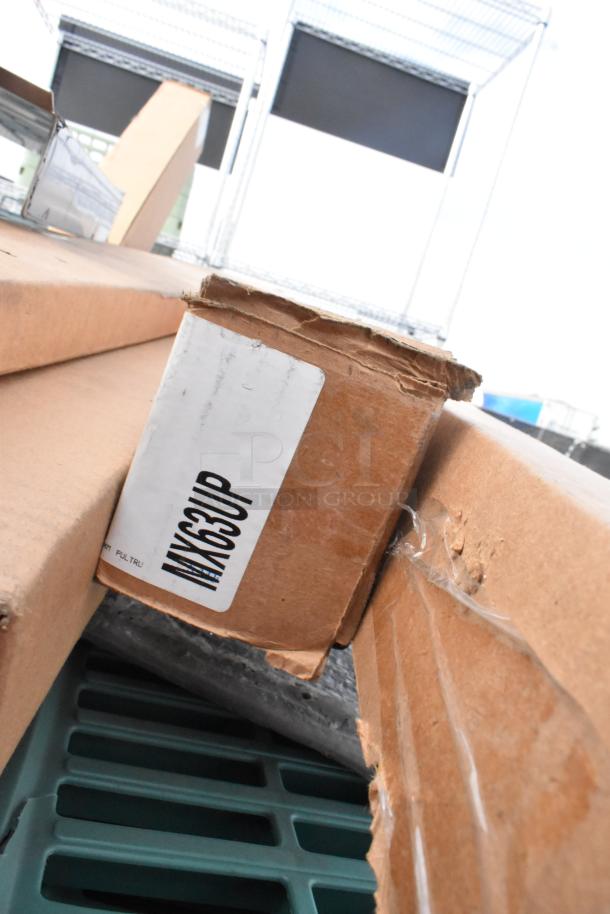 16 brand new scratch and dent items in boxes, including Metro MX63UP and Cambro shelving units. Box labeled "MX63UP."