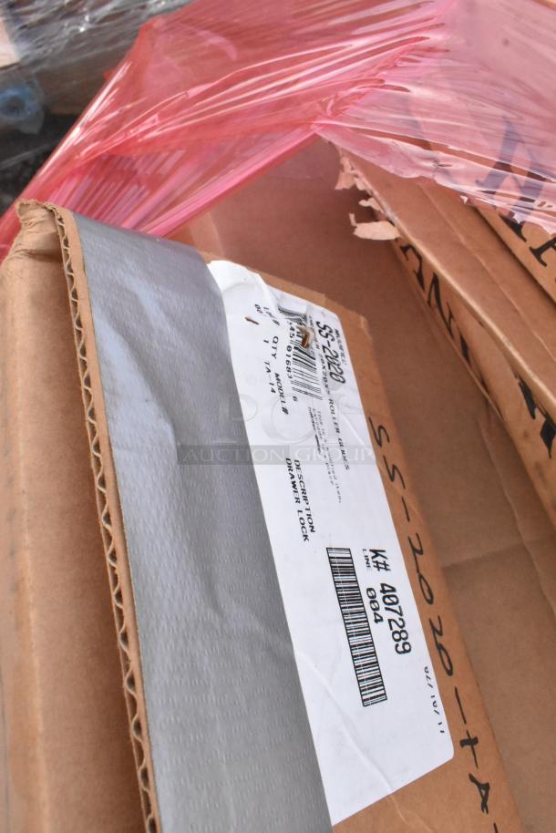 Cardboard boxes with unopened packaging, visible markings citing SS-2200, and drawer lock description, indicating storage condition.