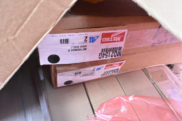 Boxes containing new Metro MetroMax Q 21" x 54" shelves, labeled with product details and quantity.