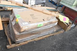 12 new scratch and dent items including Focus FF2436G shelf and John Boos EPP-74-G post, on pallet, labels visible.