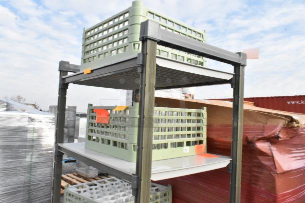 4-tier metal shelving unit with green plastic crates. Shelves hold assorted items. Shelving in good condition. Visible orange tags.