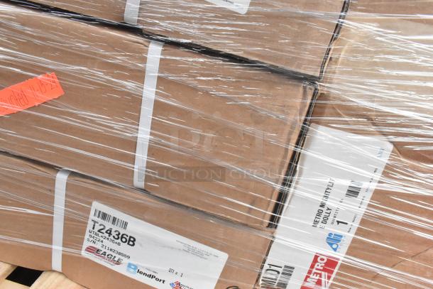 11 brand new scratch and dent items, including Eagle Group T2436B work table and Metro MLD1 dolly, wrapped in shipping plastic.