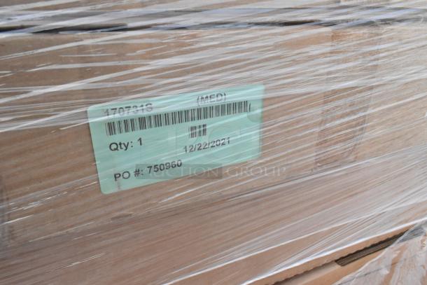 Cardboard boxes wrapped in plastic with a visible tag showing item details, including quantity "1" and PO number "750960".