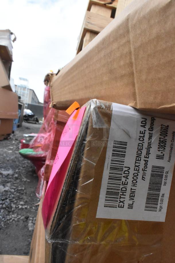 Cardboard shipping box with visible label showing "ML: EXTENDED, CLE ADJ" and other product details, wrapped in plastic.