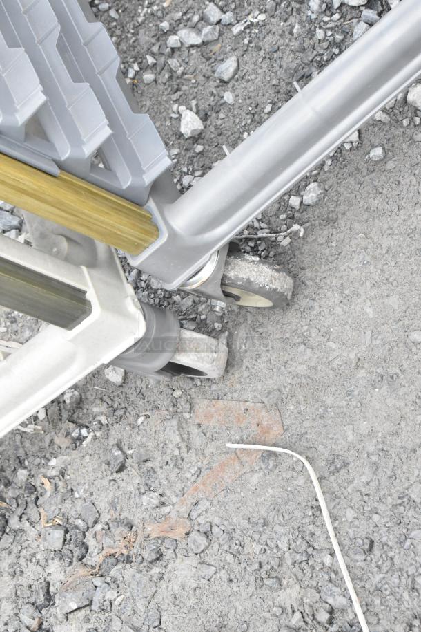 Metal commercial pan transport rack, features sturdy metal frame and commercial casters, in good condition.