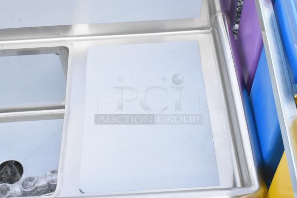 Brand new Steelton 522S31818LRC 57" stainless steel corner sink with three 18"x18"x12" compartments, two drainboards. No legs.