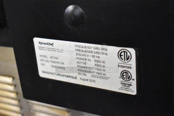 2022 XpressChef JET19V stainless steel rapid cook oven label, showing model and voltage details, ETL certified.
