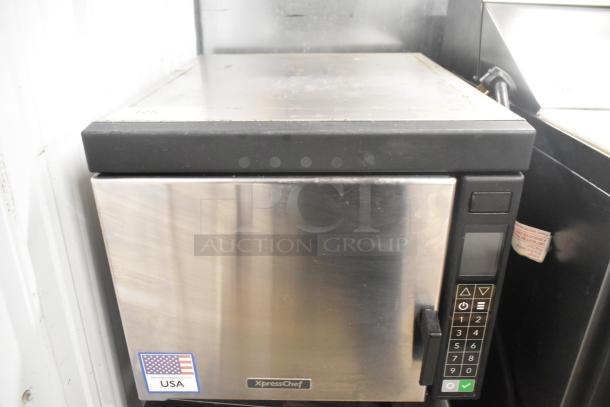 2022 XpressChef JET19V stainless steel rapid cook oven. Features keypad, USA label. Commercial countertop model.