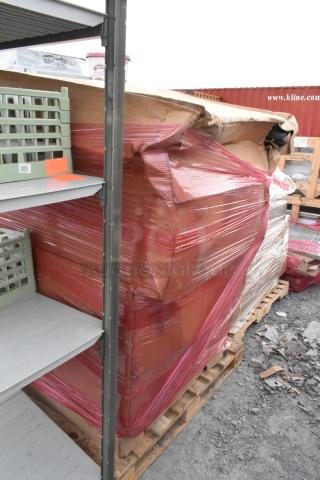 Two brand new stainless steel carts with slight shipping damage, wrapped in red plastic on a wooden pallet.