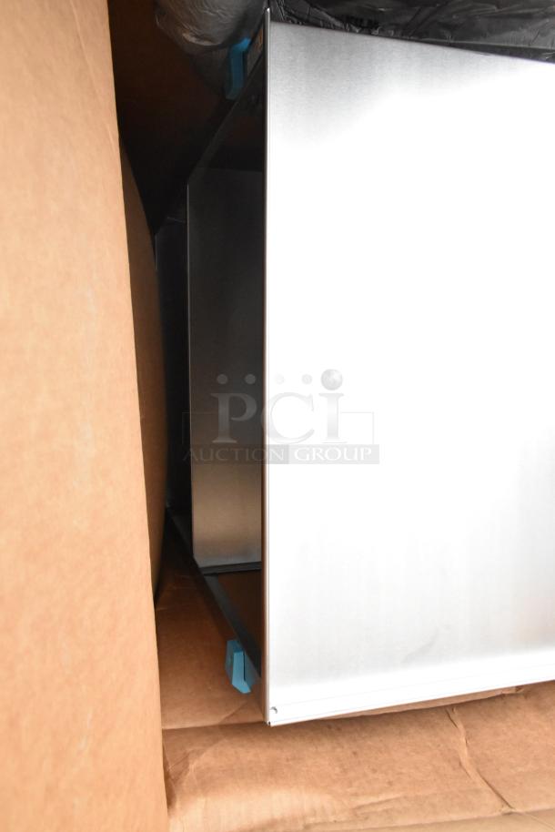 Brand new stainless steel carts, scratch and dent condition, visible protective packaging, auction includes two carts.