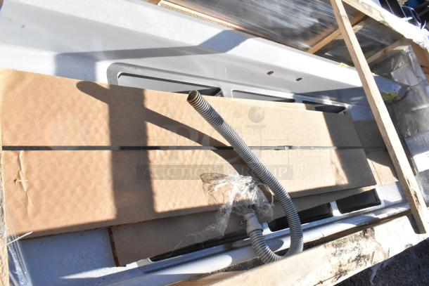 Brand new Regency 600S31824218 stainless steel 3 bay sink with dual drain boards, scratch and dent, no legs.