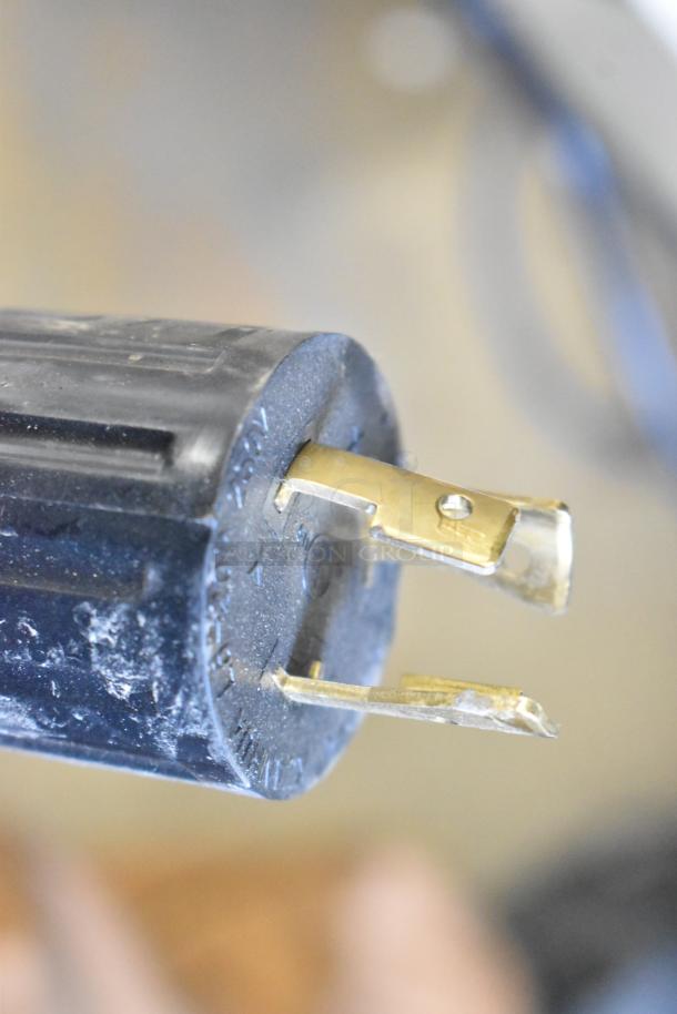 Close-up of a power plug for the Grindmaster 1000666GM PB10US Ecoboiler, 240V, 1 Phase, showing minimal wear.