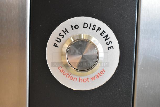 Close-up of Grindmaster 1000678GM Ecoboiler dispenser button, labeled "PUSH to DISPENSE" and "caution hot water".